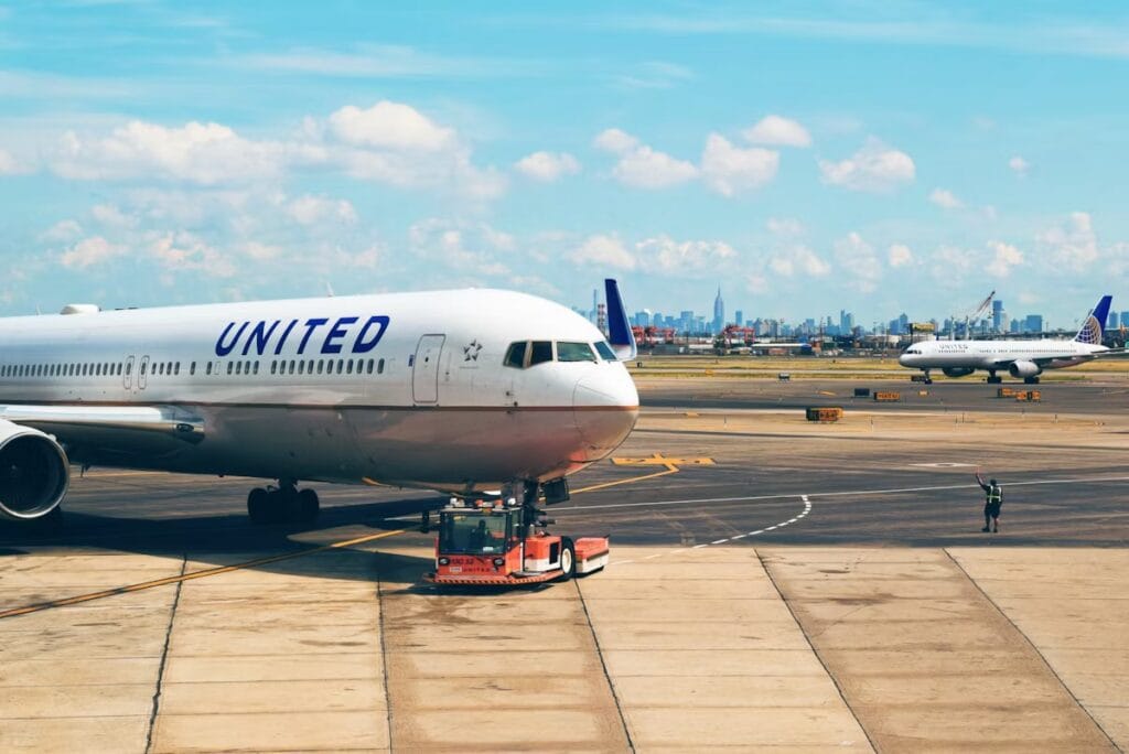 United Airlines aircraft on the runway at an airport, ready for departure to a major U.S. destination.