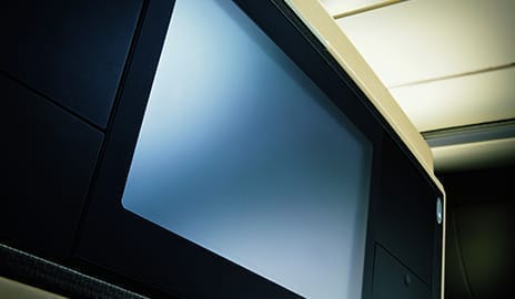 In-flight entertainment screen on a Singapore Airlines flight, providing passengers with a wide selection of movies, TV shows, and games.